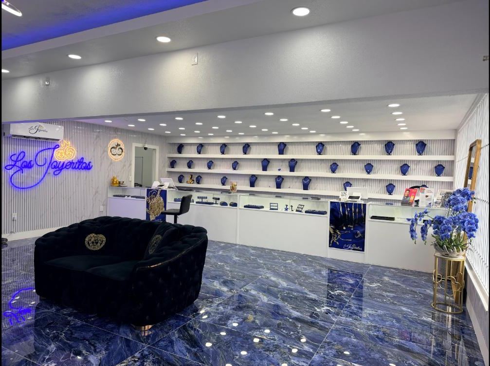The Los Joyeritos showroom wall with gold on blue busts